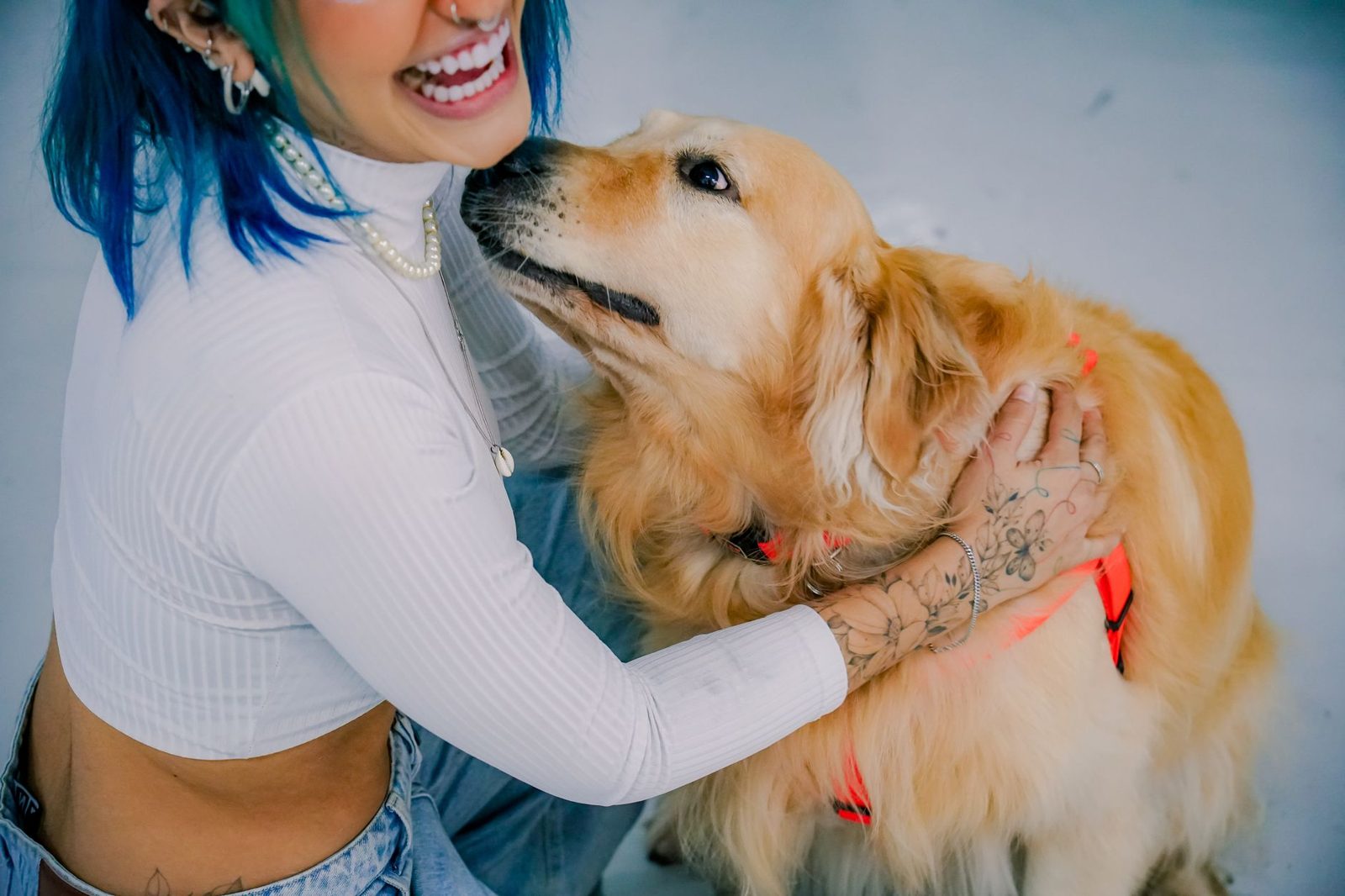 Woman hugging her golden retriever